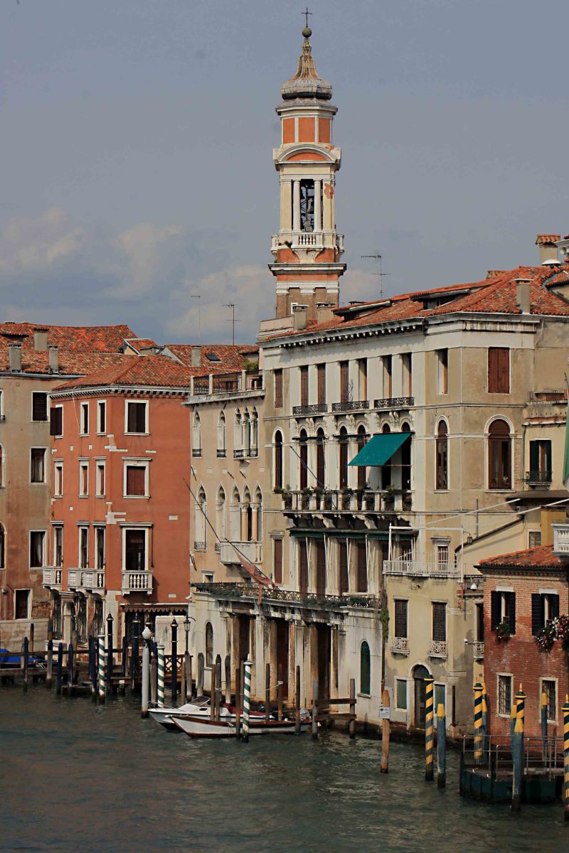Buildings on the left bank on the approach to the Rialto Bridge. The bell tower belongs to Chiesa dei Santi Apostoli di Cristo, originally built in the 7th century, but extensively reconstructed in the 16th century