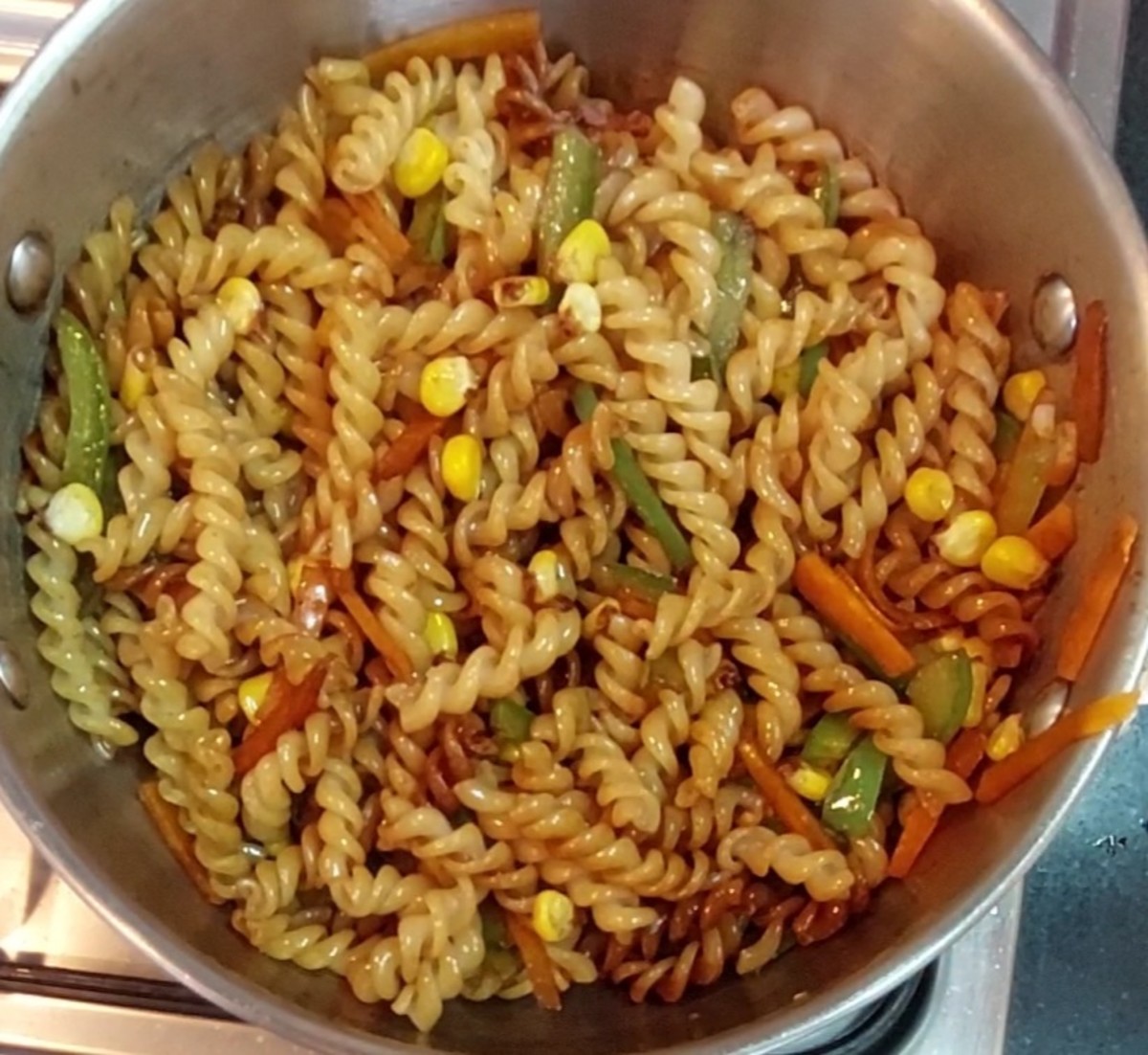 Mix to combine pasta well with sauces. Close the lid and cook for 2 minutes.