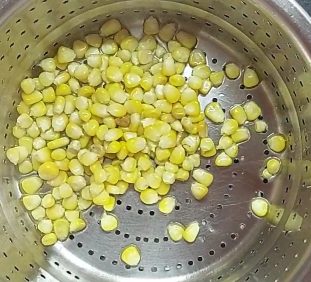 Once the sweet corn is cooked well, drain the water and set the corn aside.