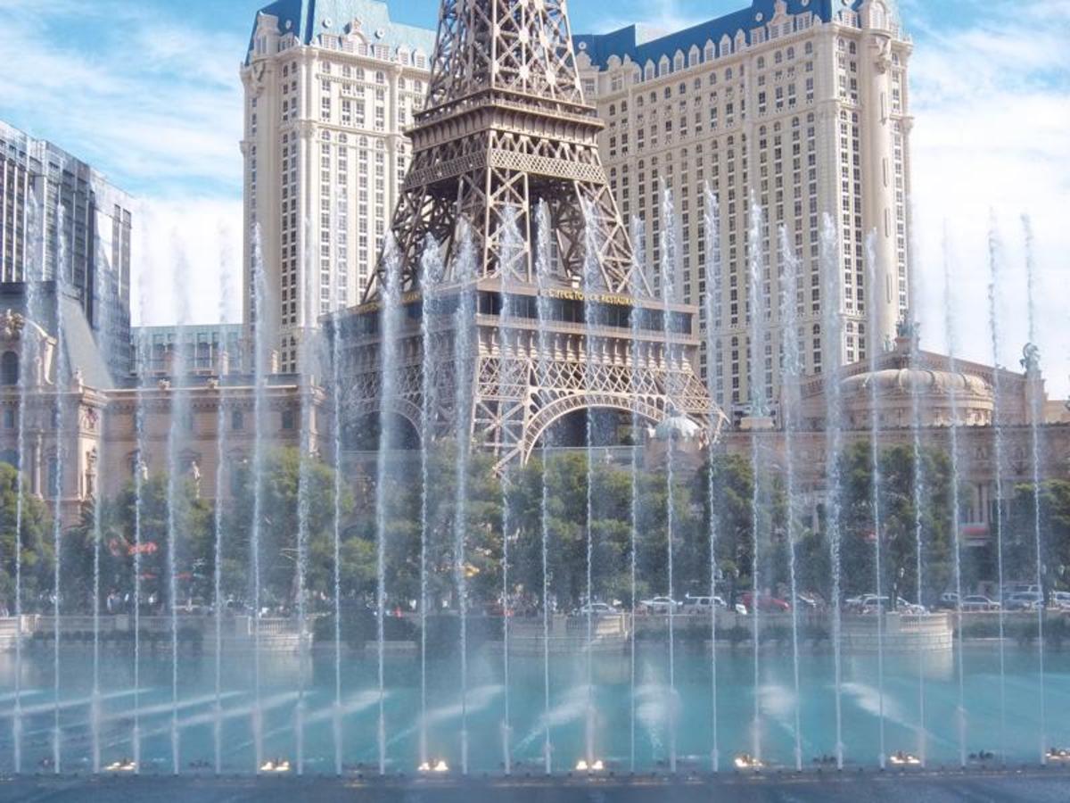 An interesting view of the Paris Hotel, seen through the fountains of Bellagio. The "Eiffel Tower" is the famous landmark, located in front of the Paris Hotel