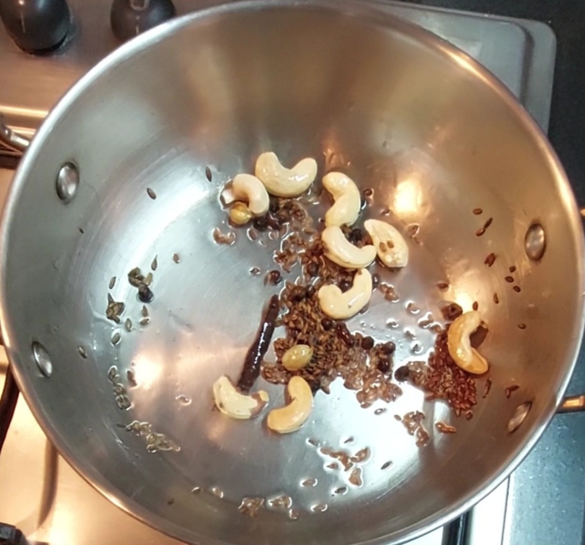 Add 8-10 cashews and fry till golden brown.