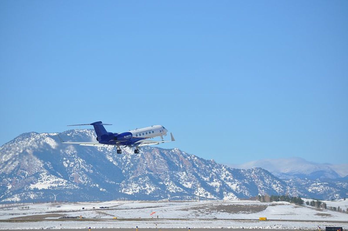 Taking off from Broomfield with Colorado Rockies in the background.