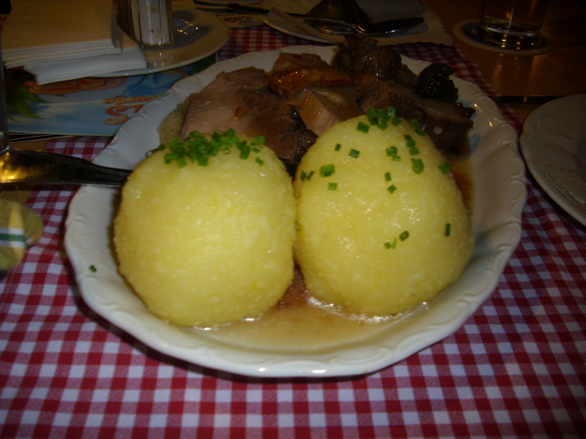 Knoedel / potato dumplings with roast pork and brown gravy.