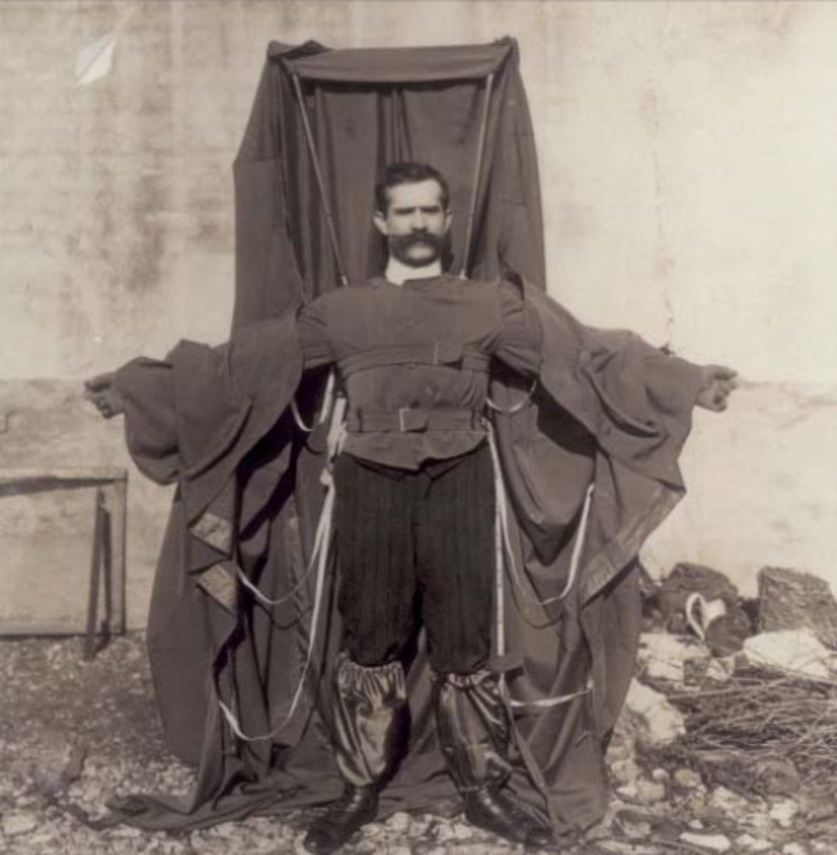 The luxuriantly mustachioed Franz Reichelt showing off his ineffectual parachute.