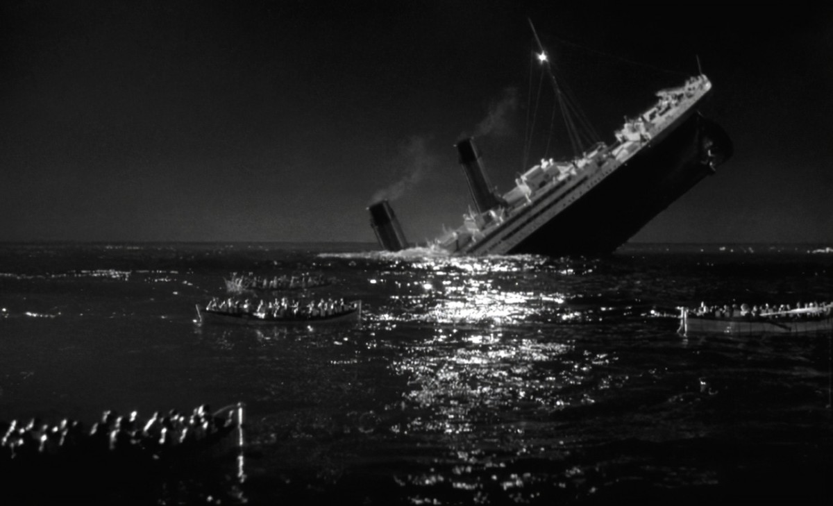 The Titanic begins her final plunge as survivors watch in horror
