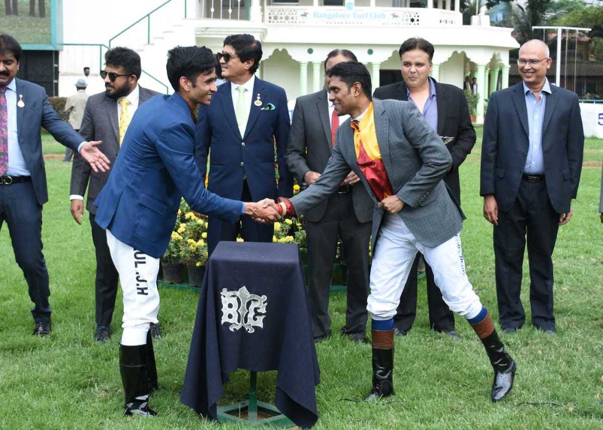Arul JH congratulating Suraj Narredu for winning the Champion Jockey Trophy (Div-1) on Promise Kept