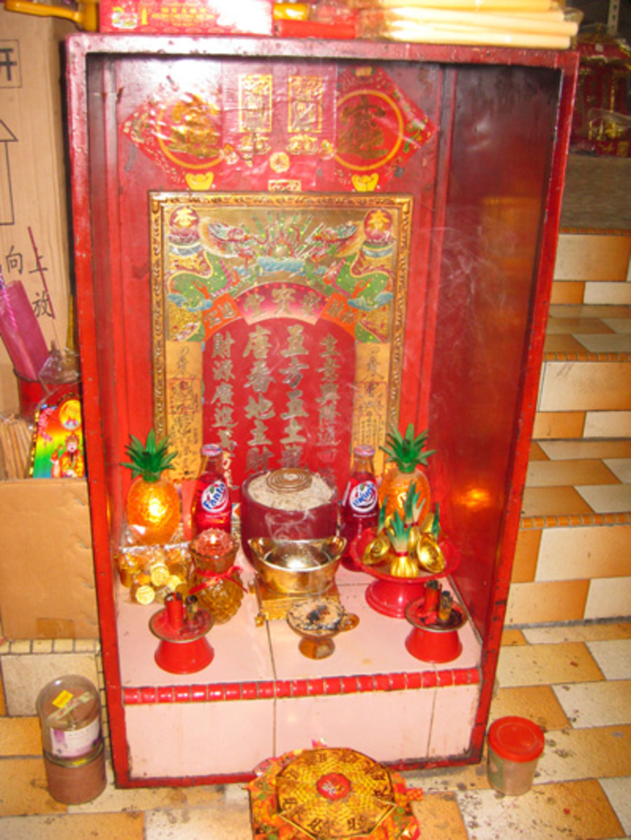 A Chinese altar containing offerings inside a tourist shop in Chinatown, Georgetown.
