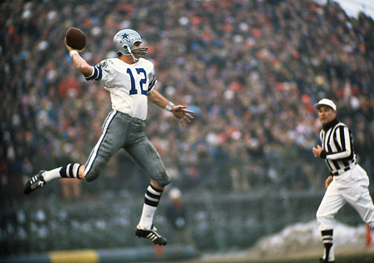 Roger Staubach attempts a jumping pass during a game.