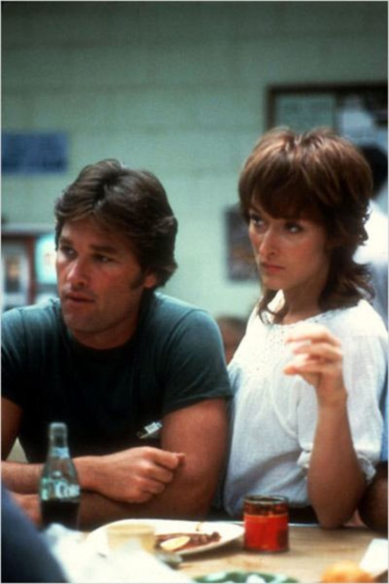 Drew (Kurt Russell) and Karen (Meryl Streep) listen intently to their union rep regarding the safety of the company