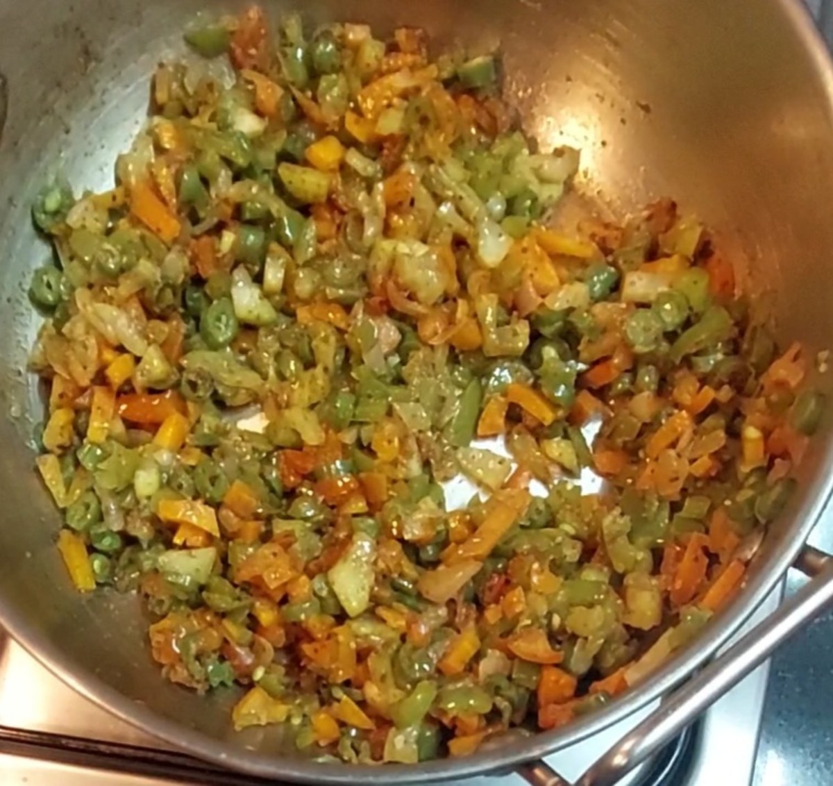 Saute till spice powders combine well with the vegetables.