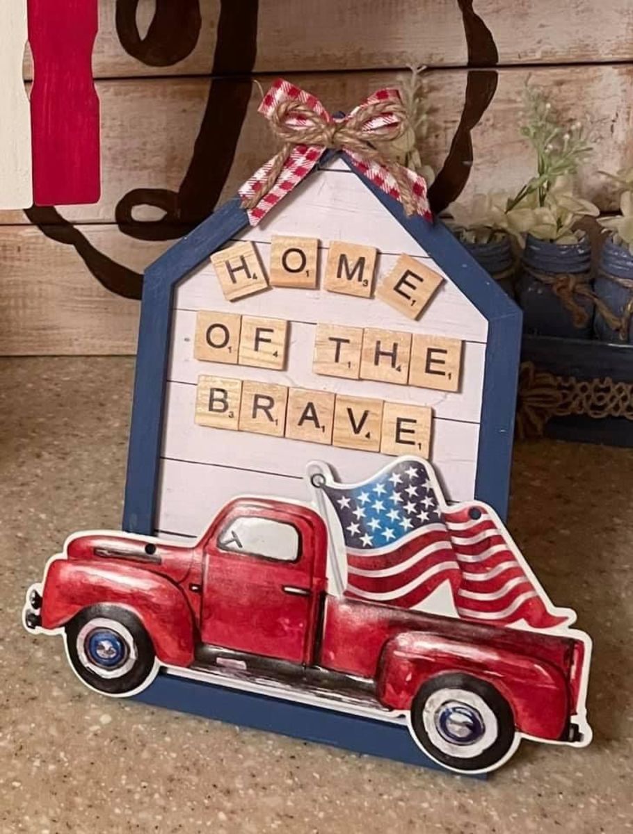 "Home of the Brave" with red truck