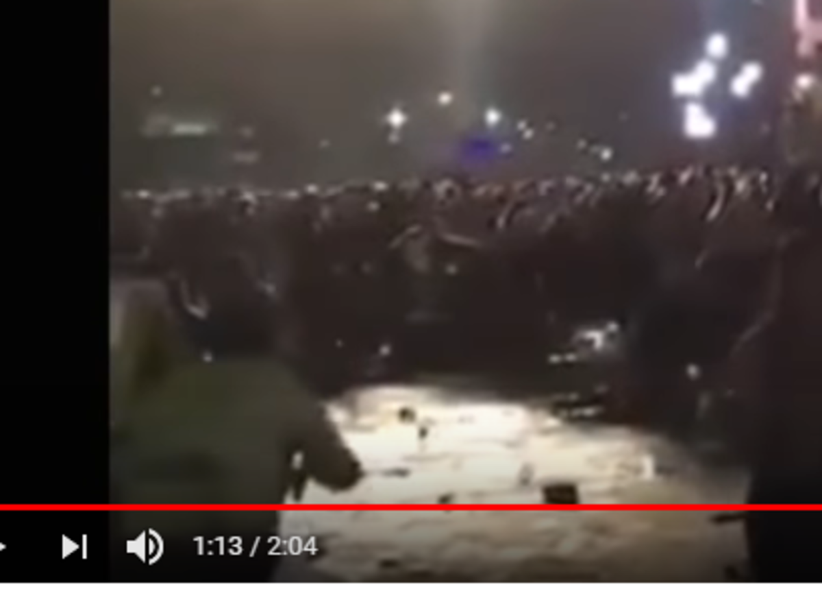 Man on left appearing to shot into crowd, see source video.