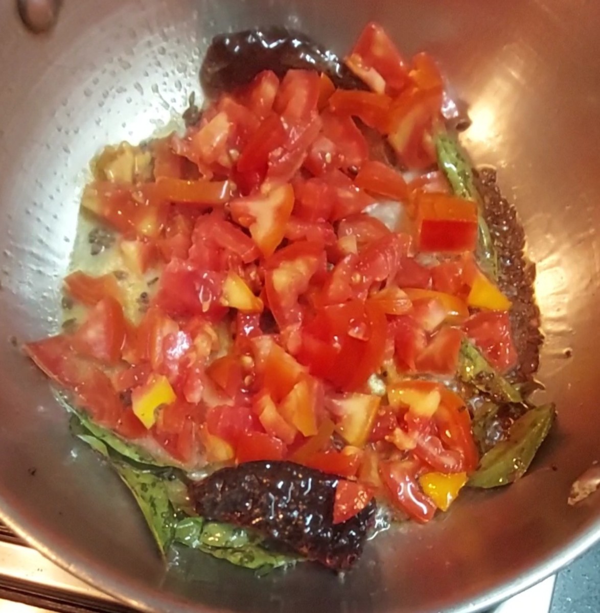 Add 2 medium-sized chopped tomatoes.