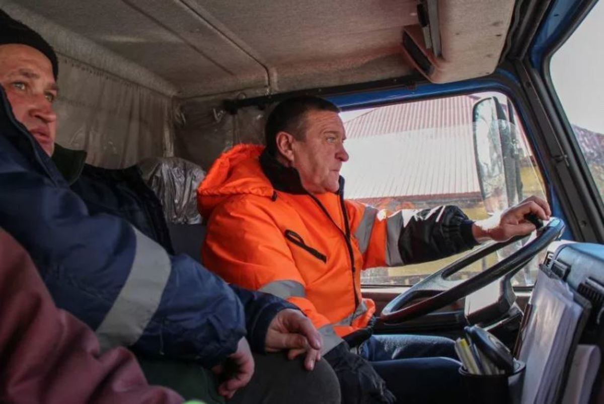 Igor Oveshkov, a garbage truck driver, on his daily routine to pick up litter around Kyiv.