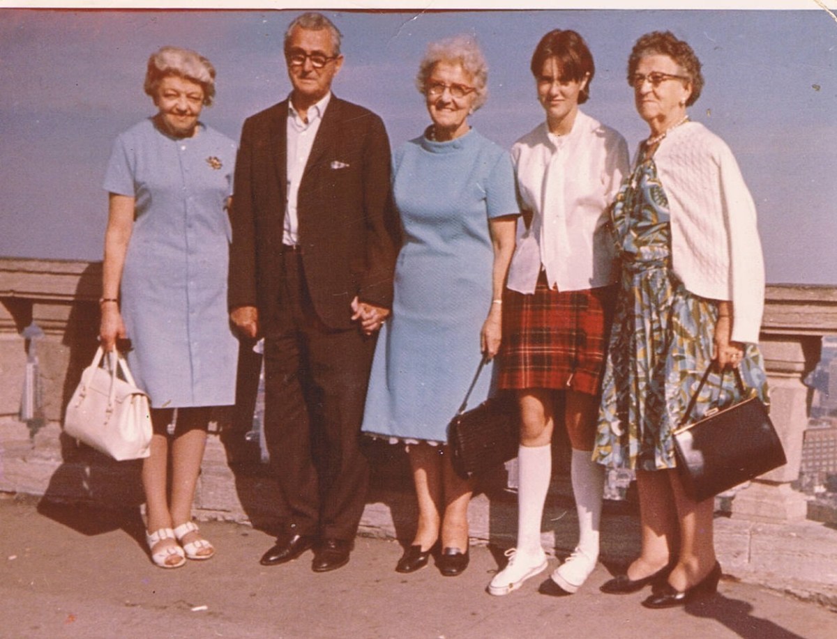 Me in my Kilt that Grandma brought back from Scotland. Not sure who the lady beside my grandfather is but the lady beside me is my Aunt Mary Galloway
