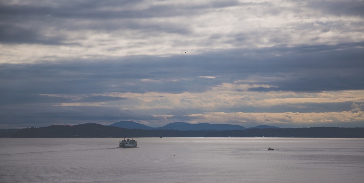 A Seattle - Bainbridge Island ferry crossing Puget Sound at sunset