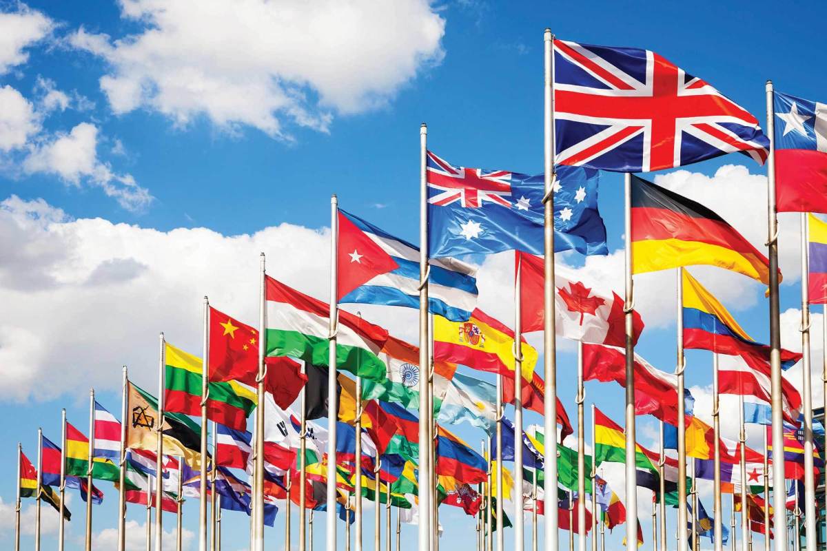 International flags flown together can suggest unity among nations.