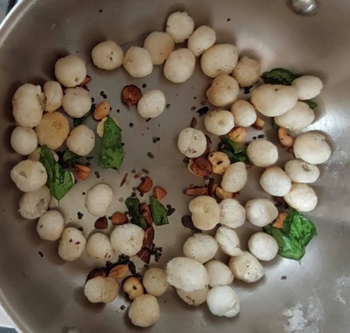 Add lotus seed and fry till crispy (for about 1-2 minutes). Switch off the flame.