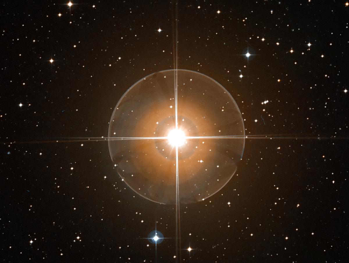 A close-up of the dying red giant star, T Leporis. It is 100 times larger than the Sun.