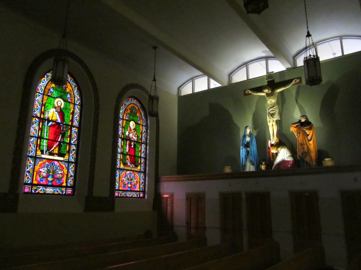 Stained glass windows and Jesus on the cross in the Saint Francis Cathedral