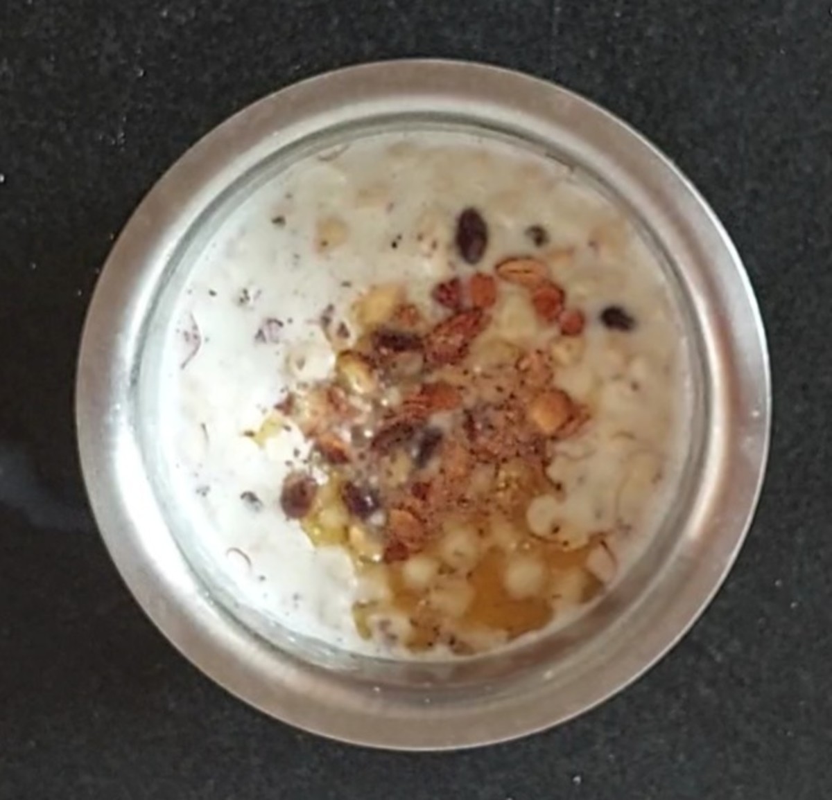 Add the nuts and raisins to kheer.