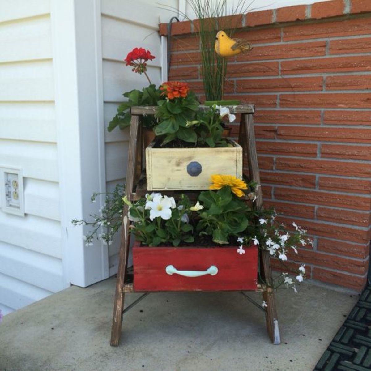 Old ladder and dresser drawers make great planters