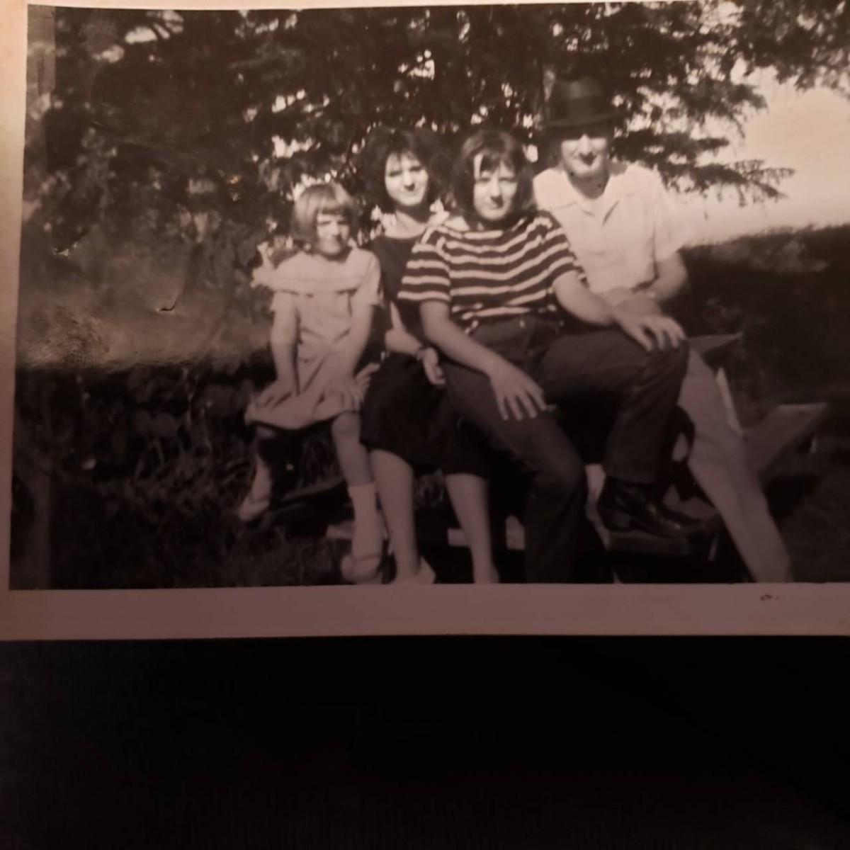 Uncle Augie with my three sisters.  Picture taken about 1966