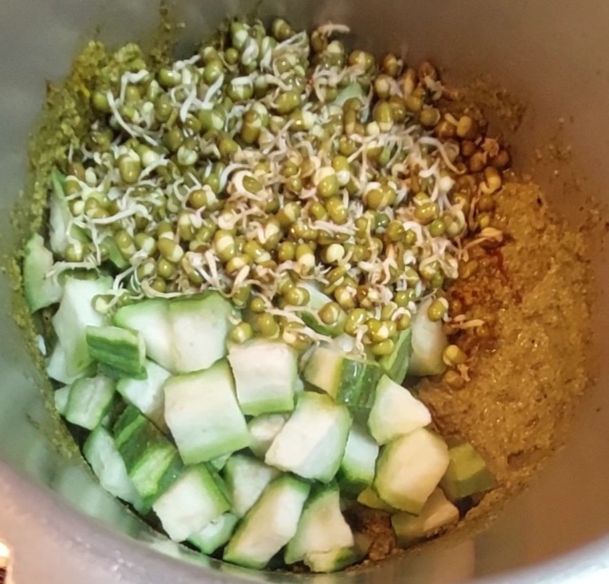 Add chopped ridge gourd and 1 cup green gram sprouts. Mix to combine with the spices and ground paste.