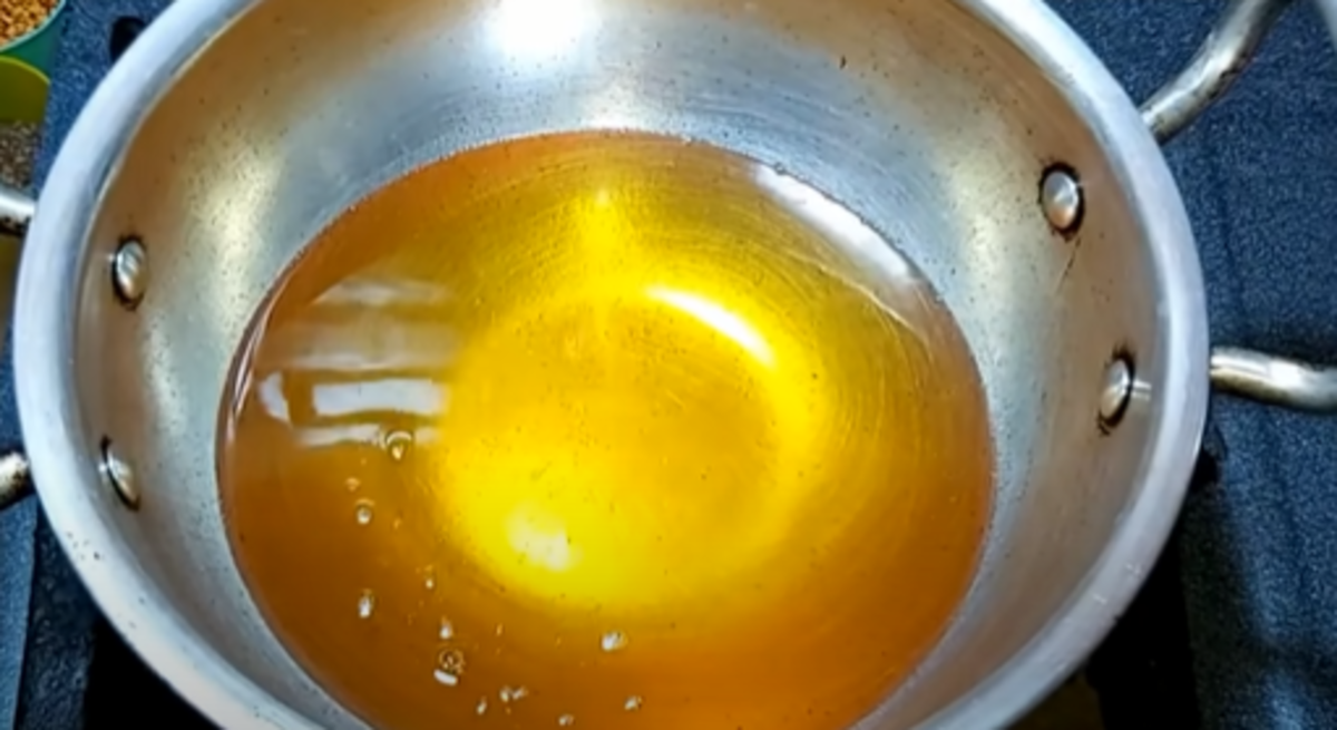 Heat oil in a wok for deep-frying. Check the temperature of the oil by dropping a small portion of the dough. 