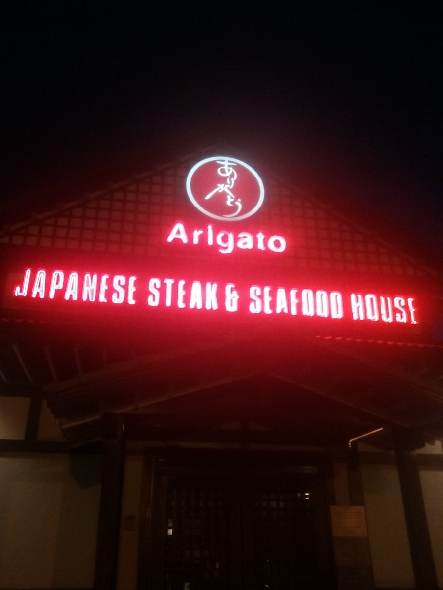 Lighted signage at Arigato Japanese Steak and Seafood House restaurant in Greensboro, North Carolina