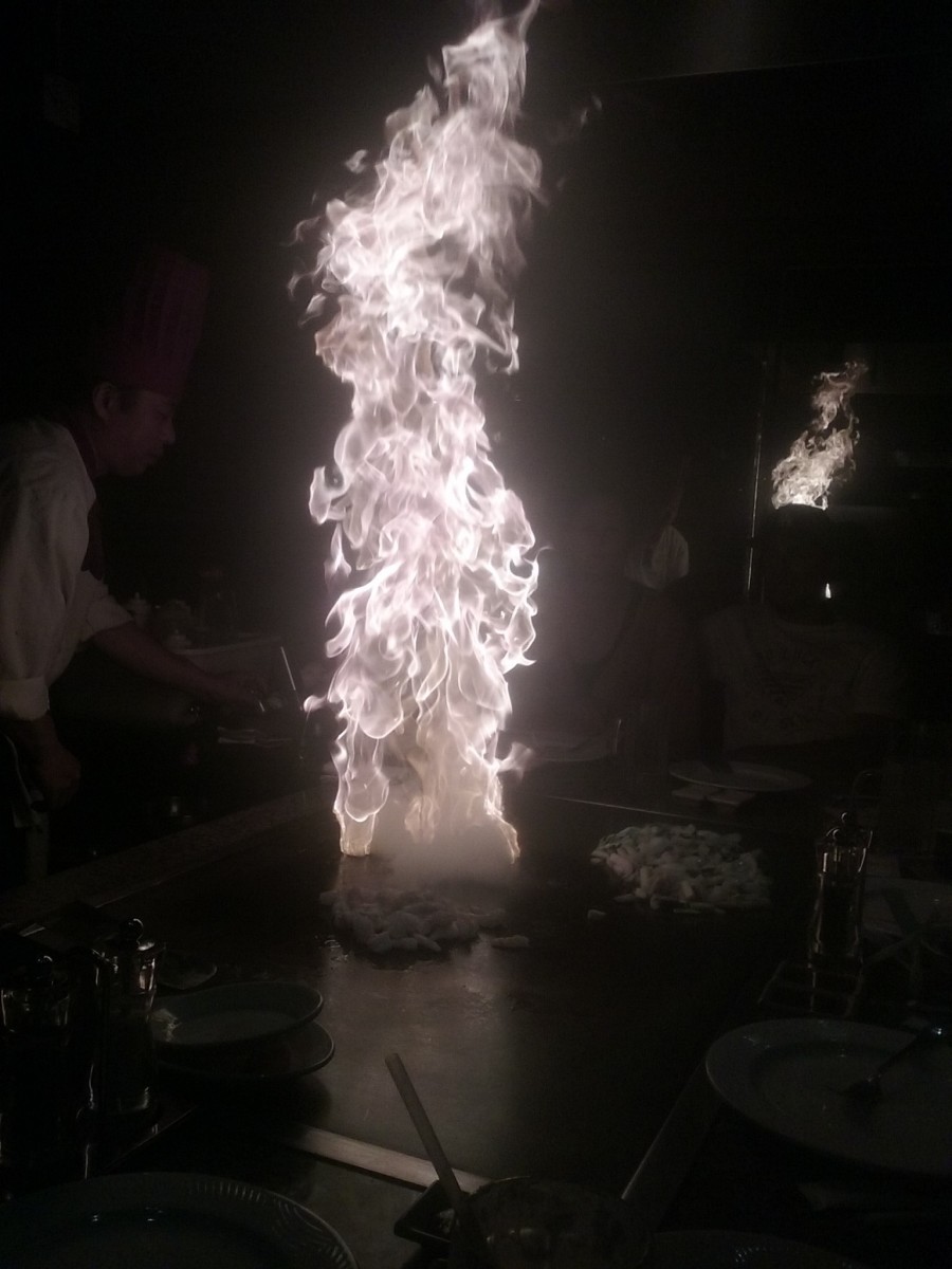 Fiery cooking demonstration at Arigato Japanese Steak and Seafood House restaurant.