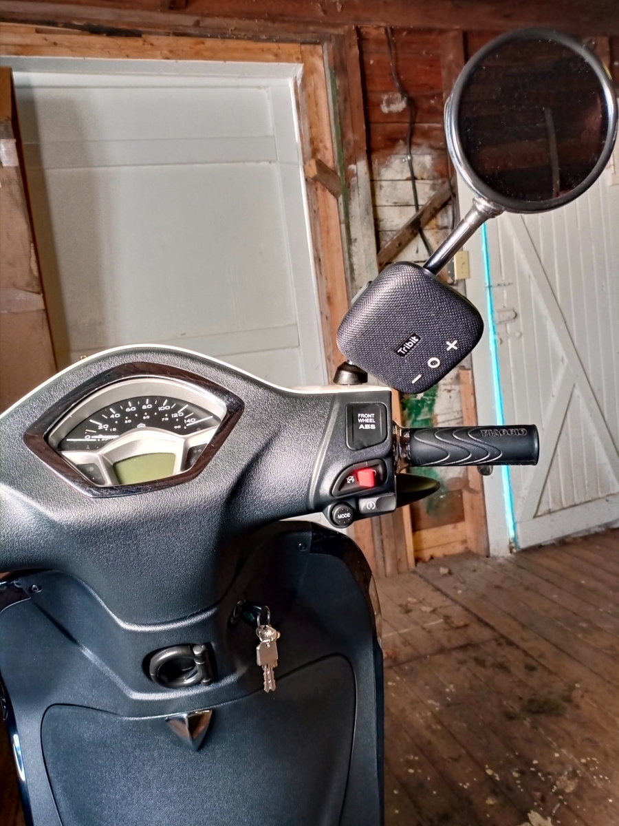 While hanging a Micro 2 speaker from my scooter's mirror is a bad idea, it could easily be strapped to the handlebar of a bike or motorcycle