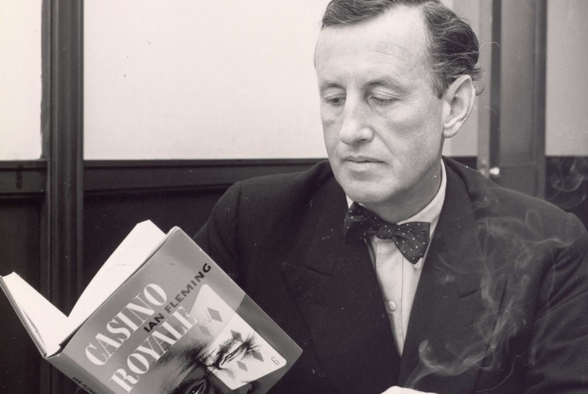 Ian Fleming looking at copy of Casino Royale