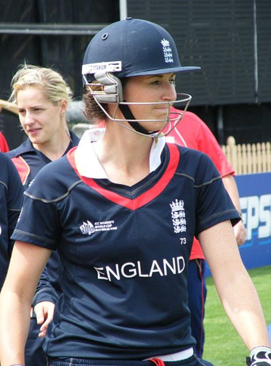 Charlotte Edwards of England's Women's Cricket Team with the three-lion emblem on her helmet and jersey.