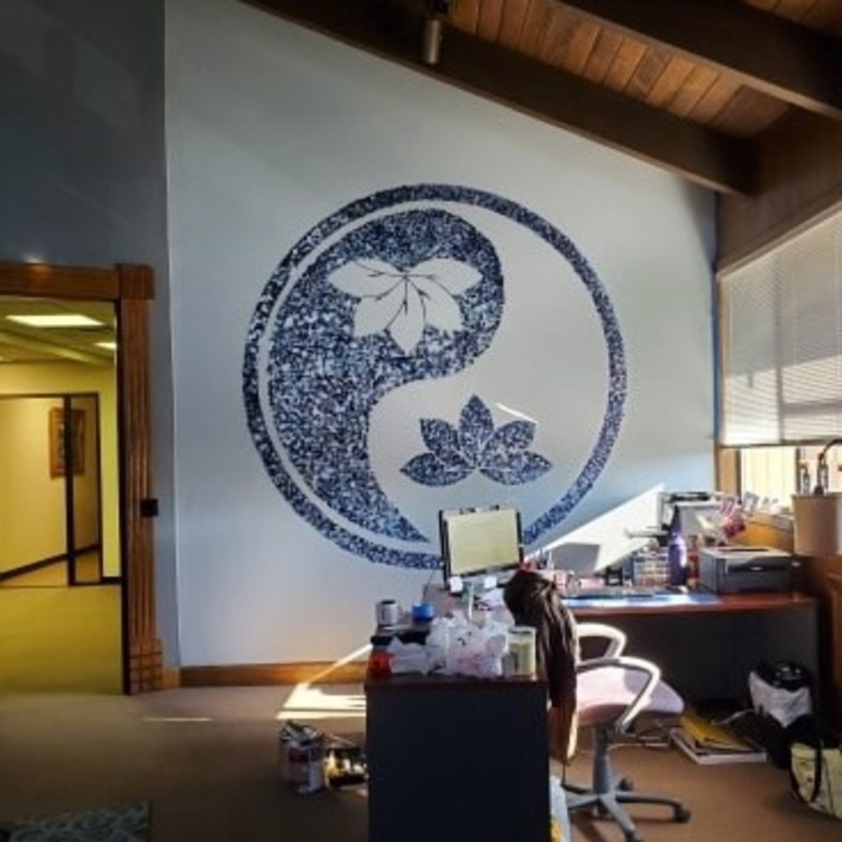 Her nice bigger office. Ying-Yang mural was done by HER.