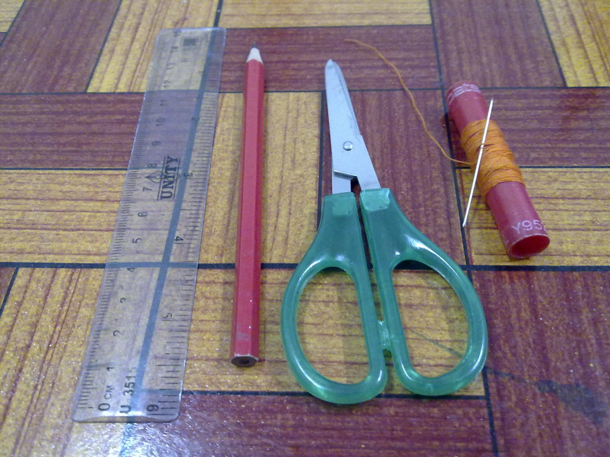 ruler, pencil, scissors, thread and needle