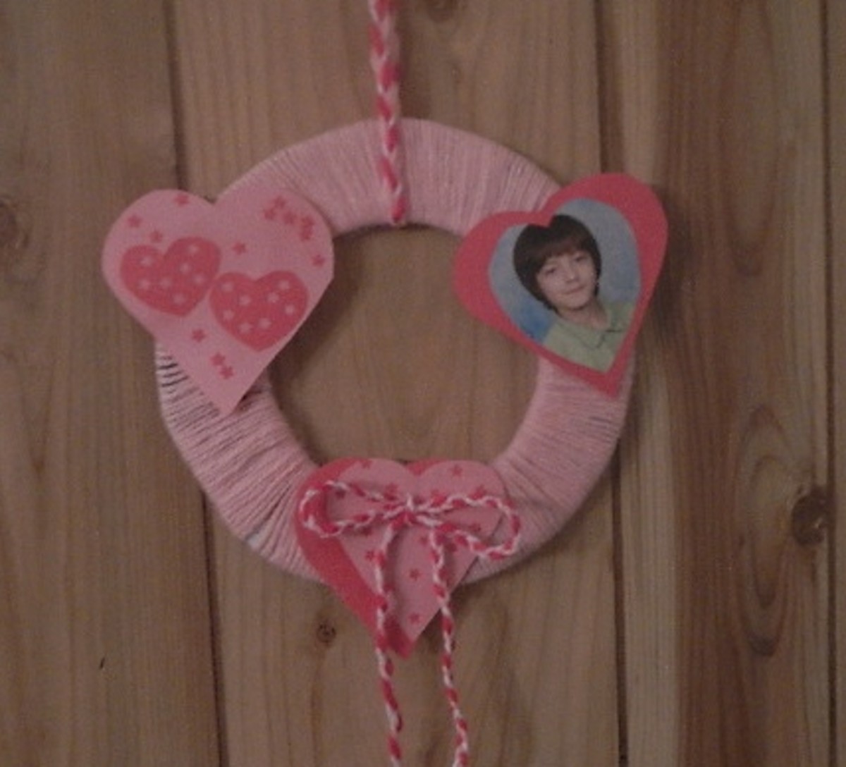 Use ribbon or braided yarn to make a hanger for your St. Valentine's Day wreath. 