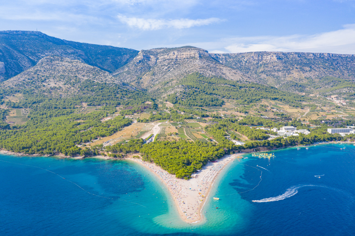 Drone shot of Zlatni Rat Beach in Croatia facing the Vidova gora peak.