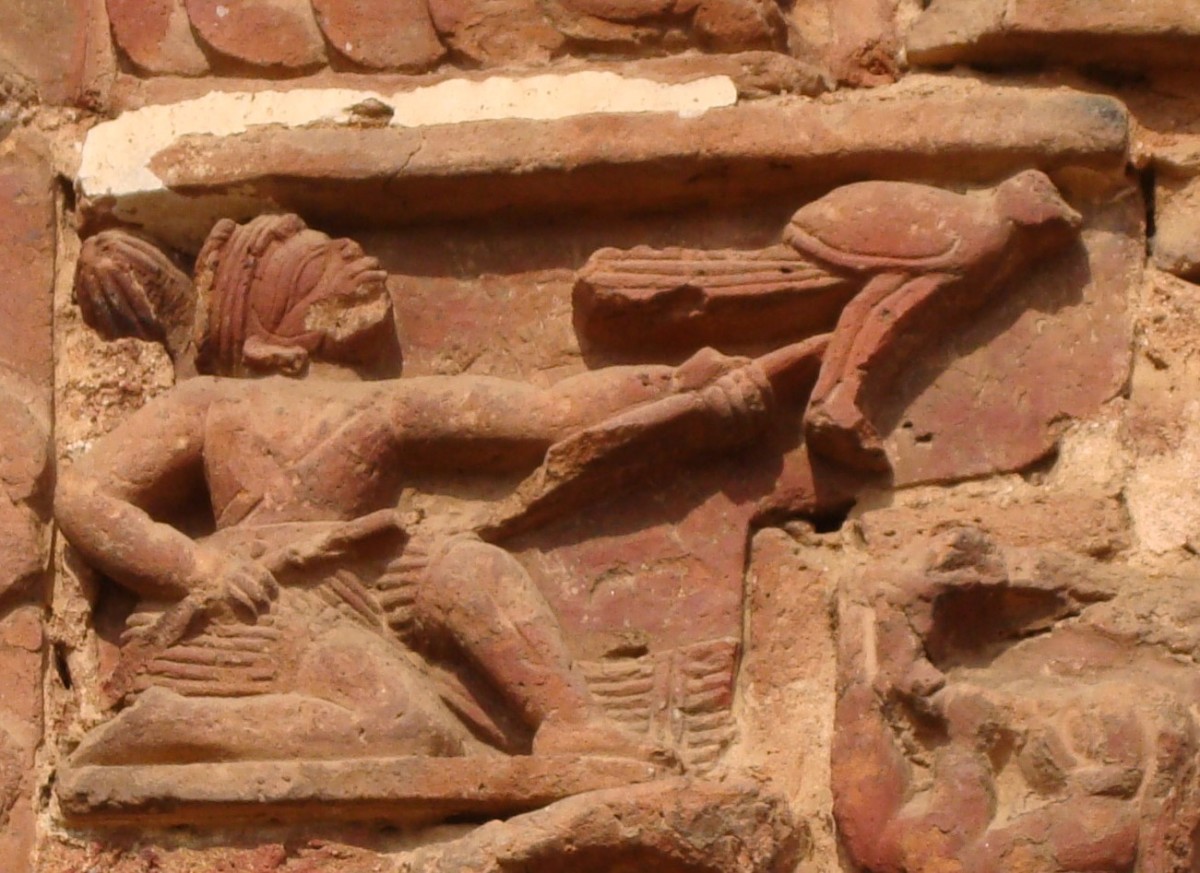 A bird hunter using Satnali for hunting birds; terracotta; Radha Vinod temple; Joydev-Kenduli, Birbhum