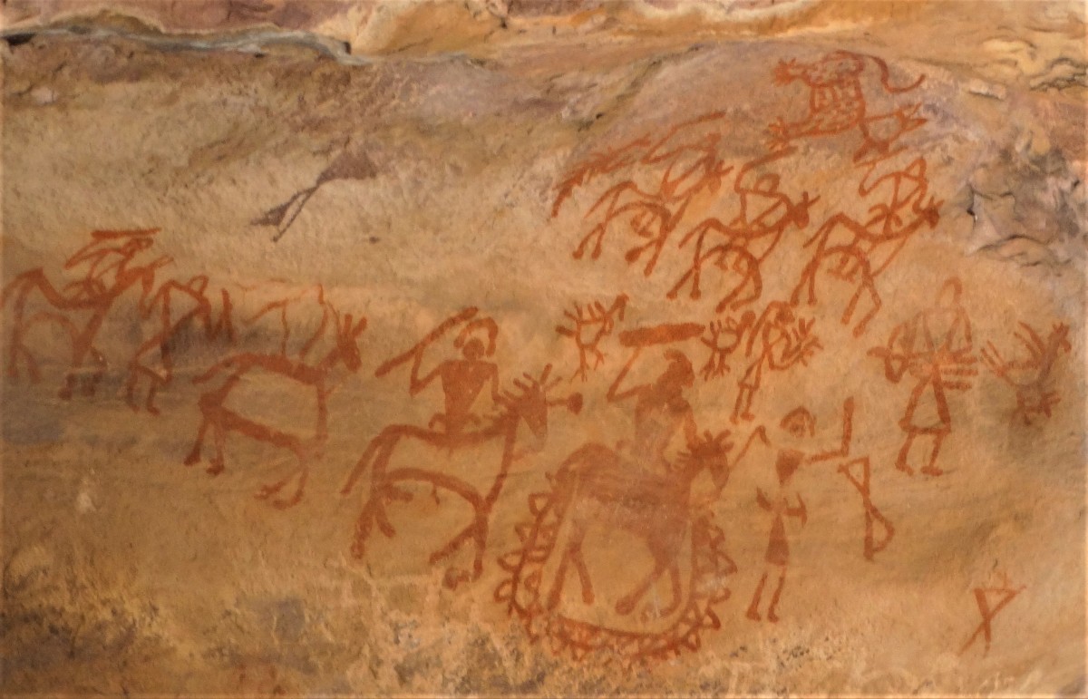 Pre-historic rock paintings showing men with spears on horseback; Bhimbethka, Madhya Pradesh, KIndia