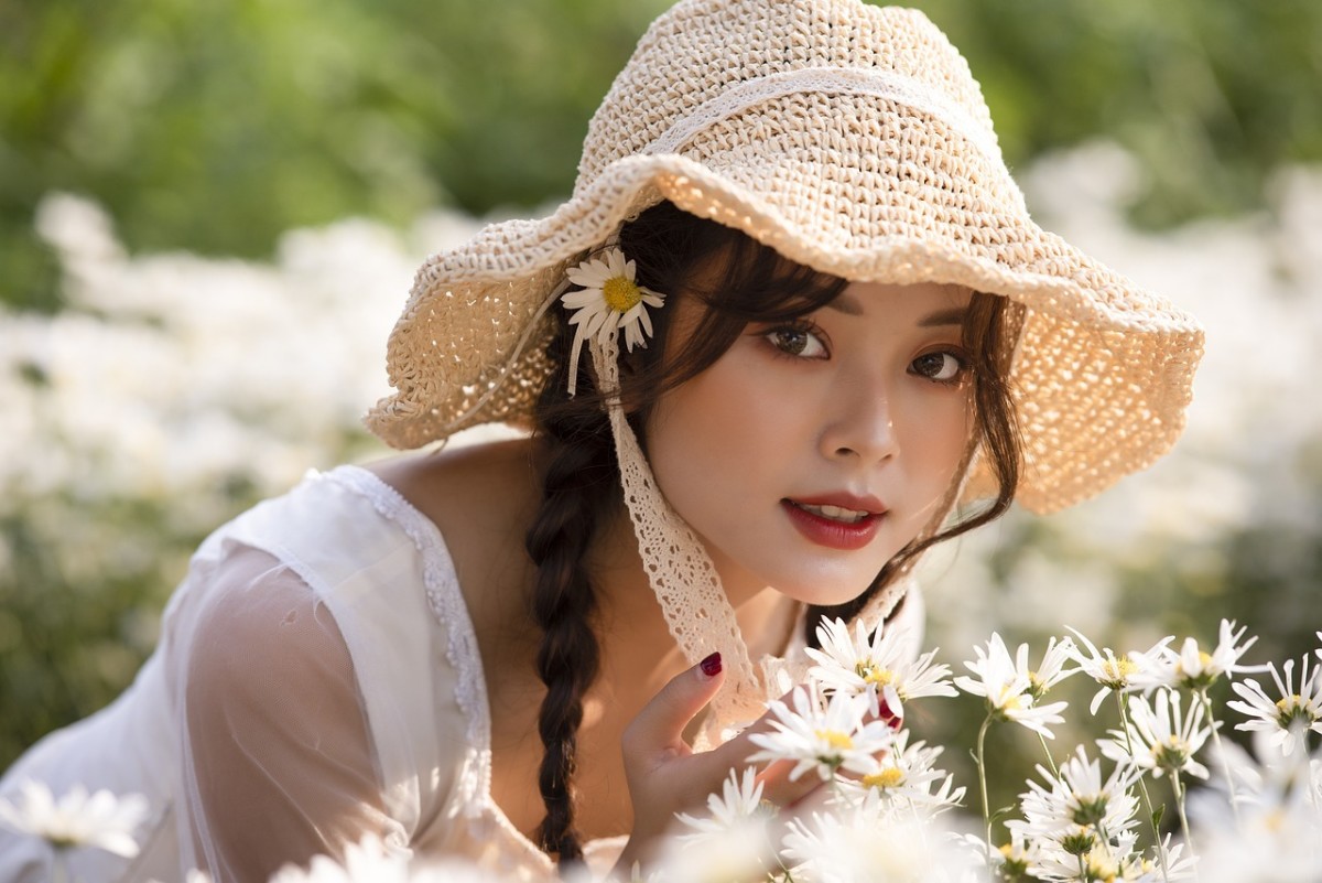 A wide hat and white clothes can help to protect you outdoors.