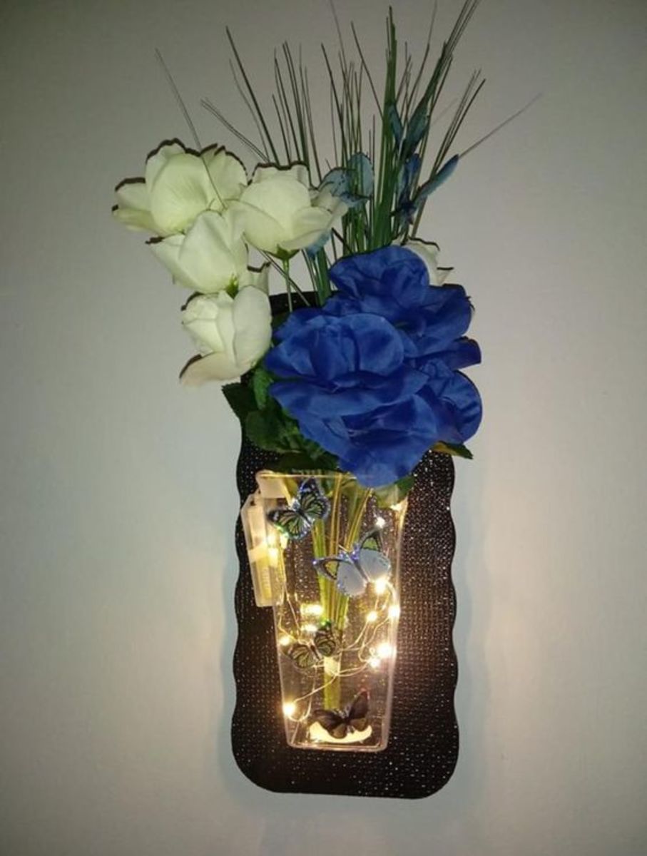 Faux flowers and butterflies with lights