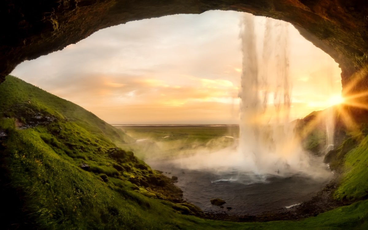 Cave-side view of Seljalandsfoss waterfall in Iceland.
