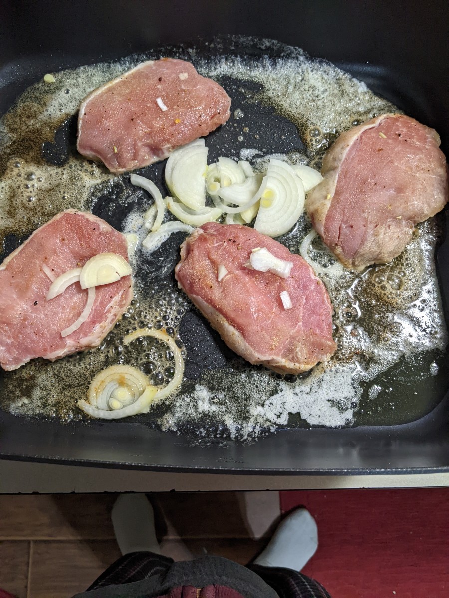pork-chops-fried-in-butter-with-onion-slices