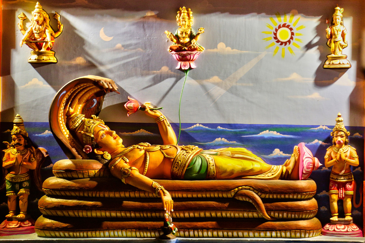 One of the main deities of Hinduism. the temple prominently displays an enormous statue of Vishnu depicted in an unusual reclining position upon the five-hooded serpent, with the whole deity measuring 20 feet square and carved from a single stone.