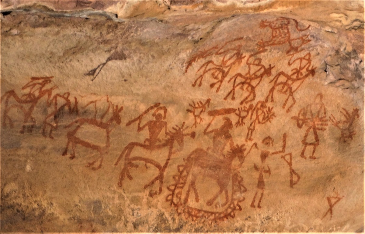 Prehistoric rock painting showing hunters with spear, both on foot and on horseback; Bhimbethka, Madhya Pradesh, India