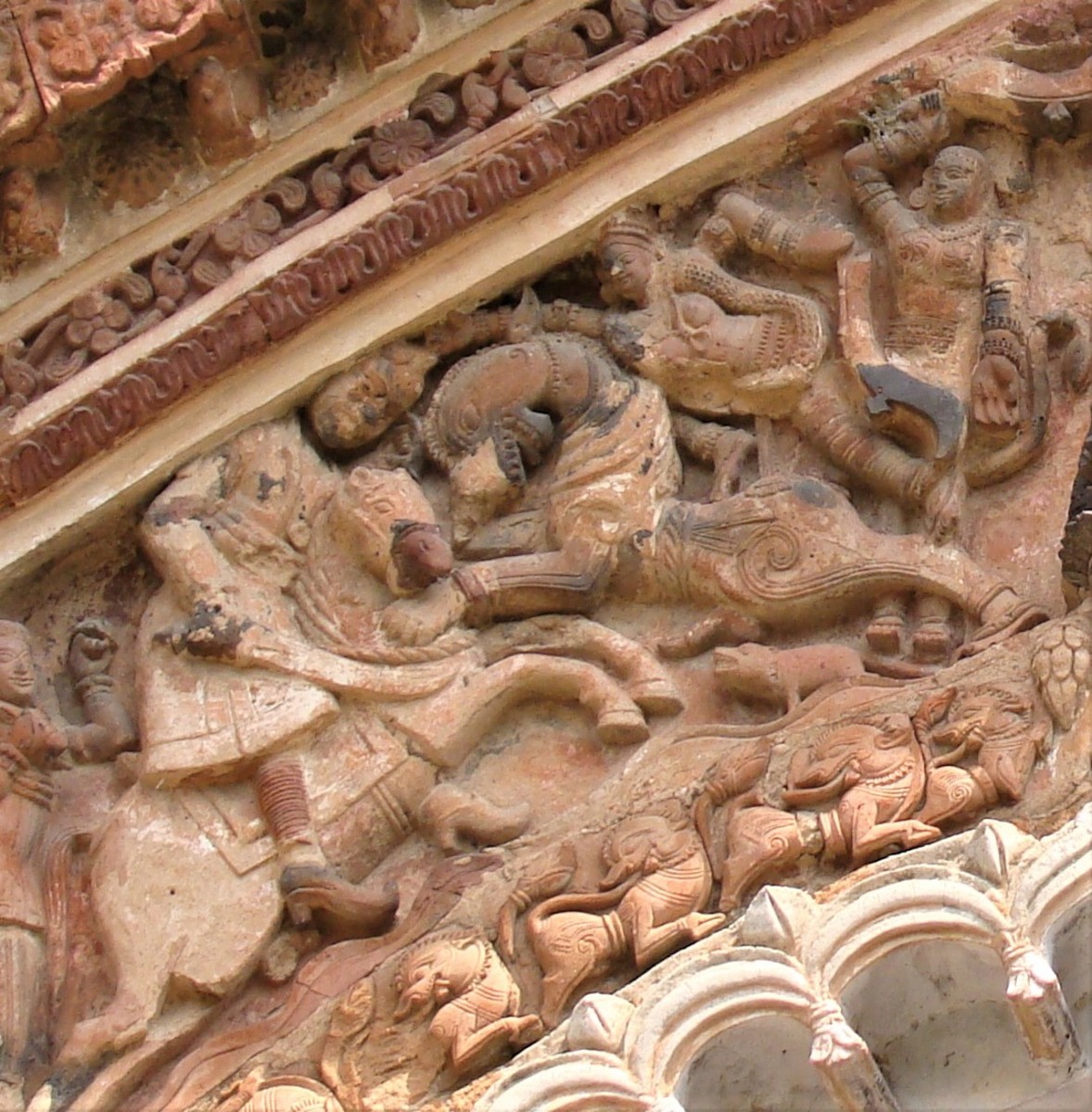 Goddess Chamunda on lion killing asura (demons); terracotta; Charbangla temple; Baronagar, Murshidabad