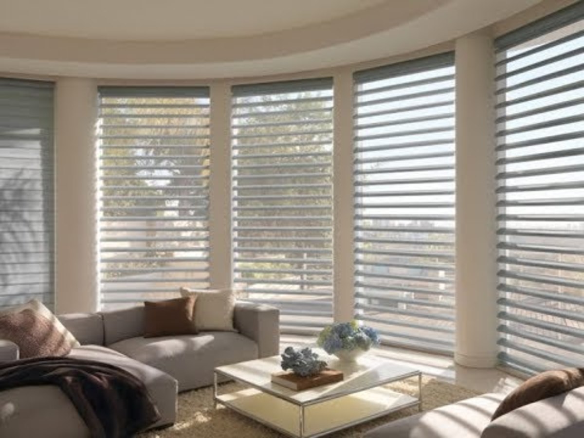Soft blinds combined with sheer fabric frames expansive windows with a light and airy look.