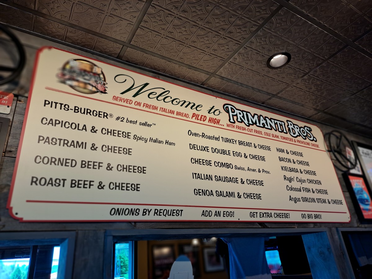 Iconic menu items on the nostalgic menu board at the Uniontown, PA, Primanti Brothers location