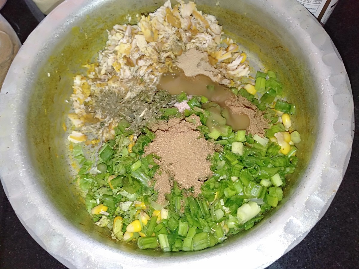 Add chopped spring onion, chaat masala, roasted dried fenugreek leaves, garam masala, cumin powder and green chilli sauce.